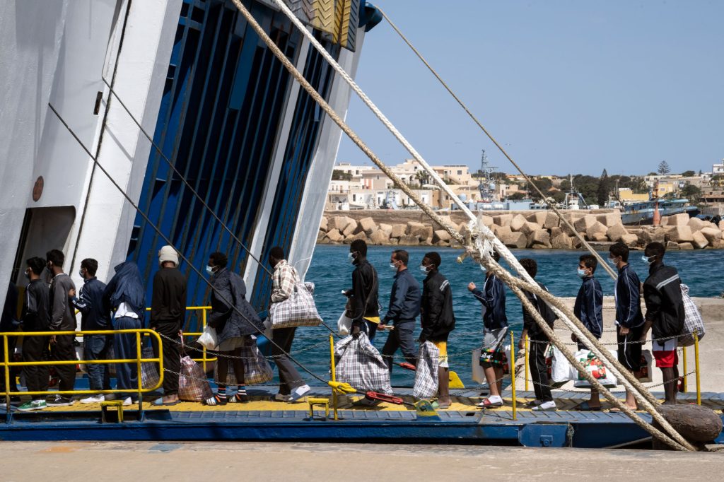 Tunisian migrants boarding the quarantine ship in Lampedusa just after leaving the hotspot. Lampedusa, 2021
